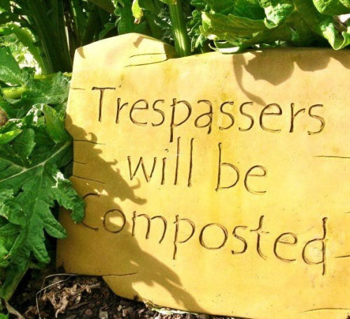 Trespassers will be composted garden sign 