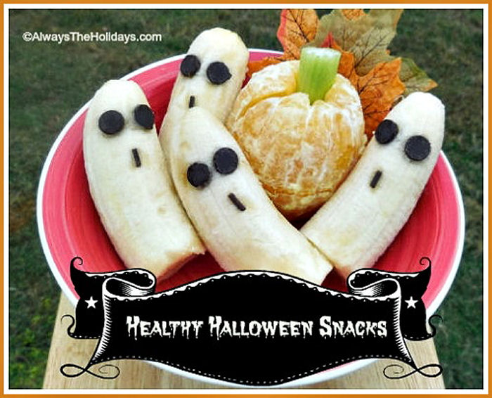 Banana ghost and pumpkin oranges on a red plate with words healthy Halloween snacks.