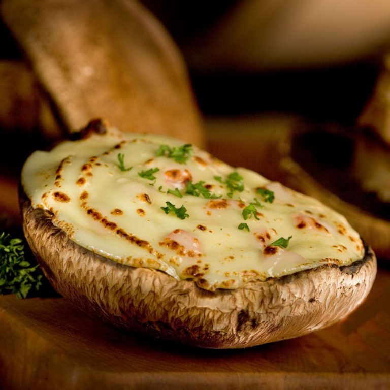 Portobello mushroom stuffed with Laughing Cow cheese and fresh herbs.