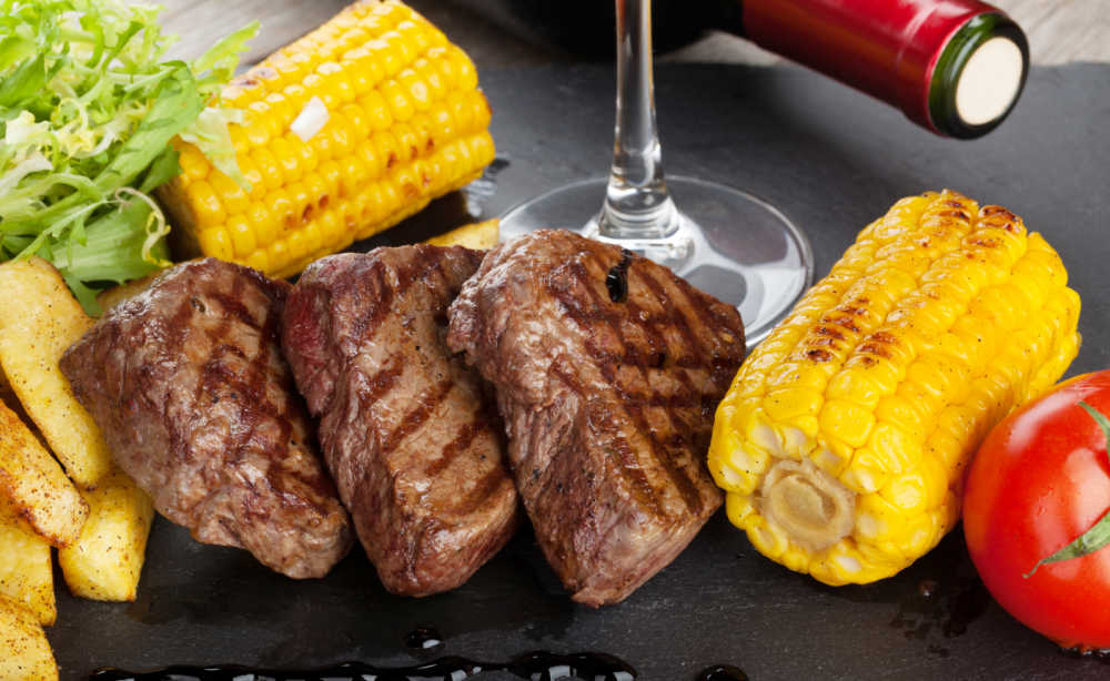 Montreal steak with grilled corn.