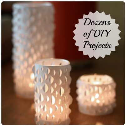 Three paper candles with a geometric shape with a text overlay that says dozens of DIY projects in the top right corner.