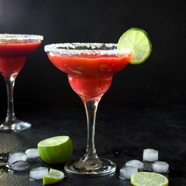 Frozen strawberry daiquiri with ice and lime.