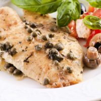 Tilapia piccata with capers and side salad.