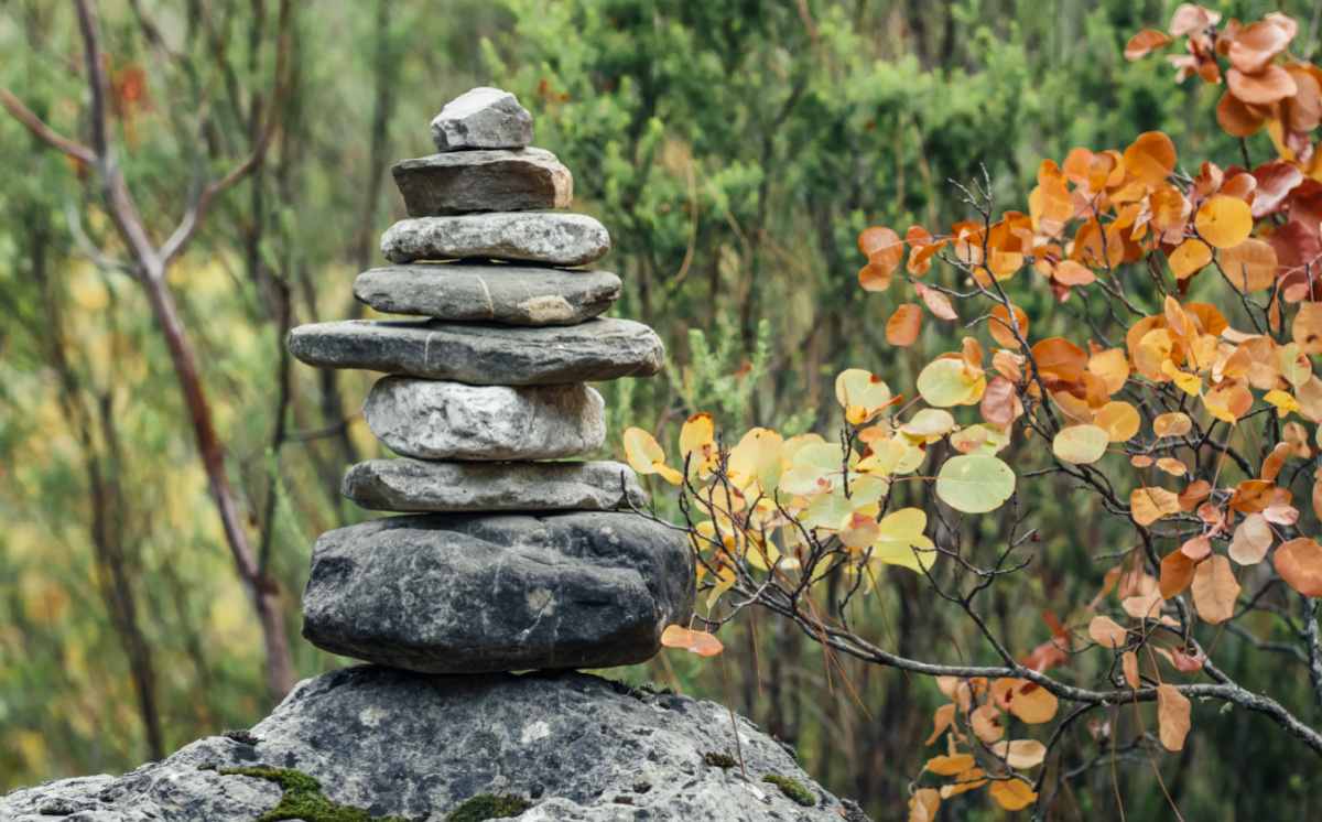 Stacked stones for meditating in a back yard meditation garden setting.