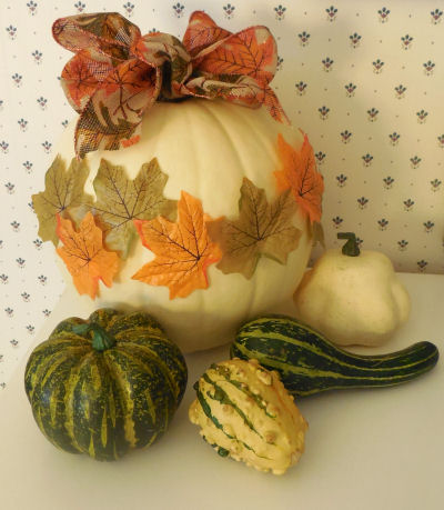 Autumn leaf pumpkin and gourds.