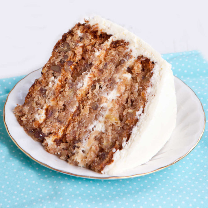 banana pecan cake on a white plate.