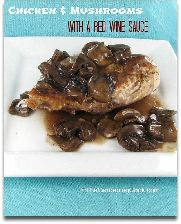 A white plate with chicken breasts, sliced mushrooms and sauce on a blue placemat. Text overlay reads chicken and mushrooms with red wine sauce.