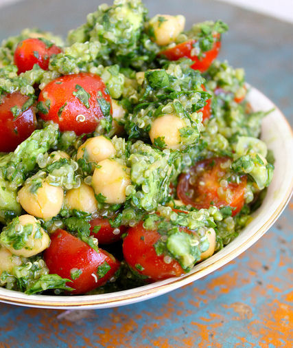 Lemon quinoa chickpea salad in a white bowl.