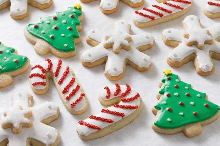 Christmas cookie shapes Cookies in the shape of candy canes, snowflakes and Christmas trees.