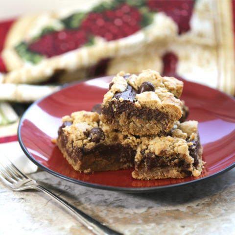 Serving a plate of chocolate peanut butter layer bars