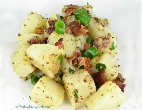 Warm German Salad with pickles, bacon and potatoes