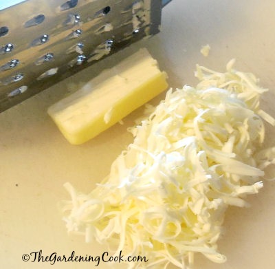 Grate butter to add it quickly to baking mixes that need room temperature butter.