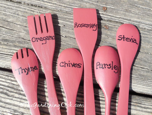 Herb names painted on wooden spoons
