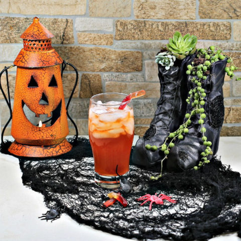 Witches brew Halloween cocktail and spooky props