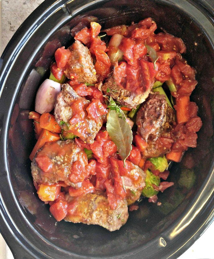 Add some liquid over the meat in a crock pot