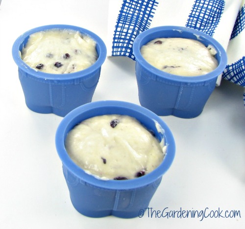 blueberry muffin batter in jeans muffin holders