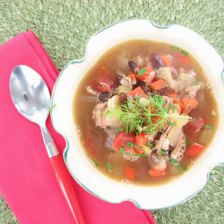 Chicken Taco Soup in a bowl with a pink napkin an dspoon.