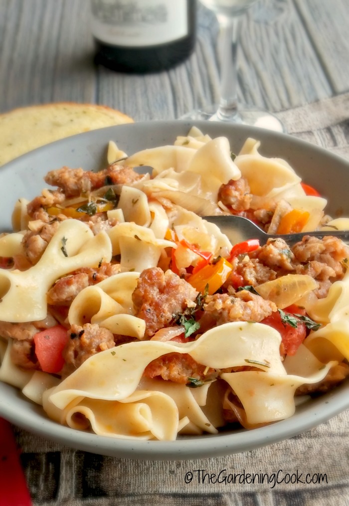 This milk Italian sausages with drunken noodles recipe has a big ole splash of wine and loads of fresh herbs and veggies. It's on the table in 15 minutes, if you can believe it and tastes scrumptious! thegardeningcook.com