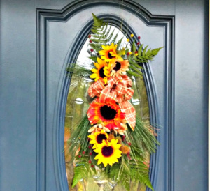 Fall door swag on a blue door.