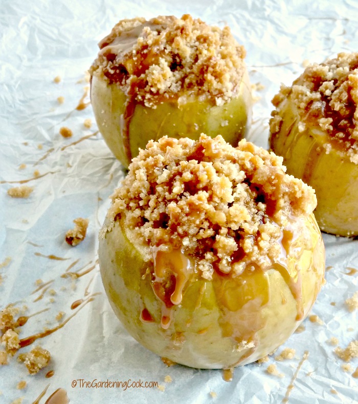 Apple crumble baked apples on crumbled paper with caramel topping.