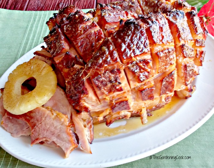 Cooking the perfect holiday ham is as easy as your secret ingredients for the glaze. This recipe is simple to do and tastes heavenly. thegardeningcook.com #ForTheLoveOfHam