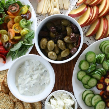 White bowls filled with appetizer recipes.