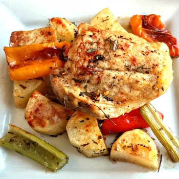 Roast chicken with oven roasted vegetables recipe on a white plate.