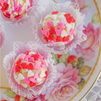 Valentine's Day food - heart truffles on a pink plate.
