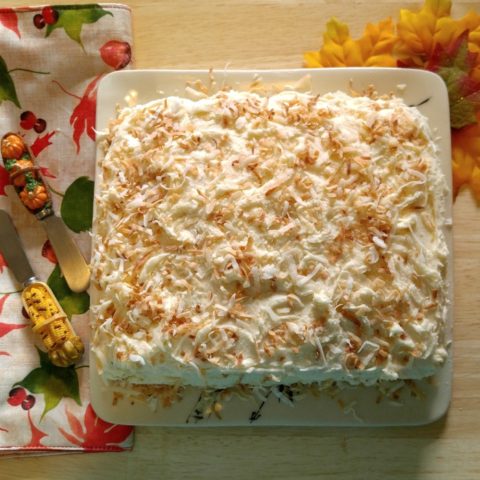 This pumpkin cake is moist and delicious and has a crunchy toasted coconut frosting.