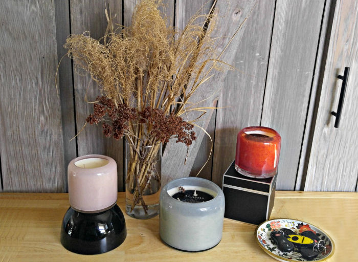 Have a trio of candles waiting for your guests on the entry table.