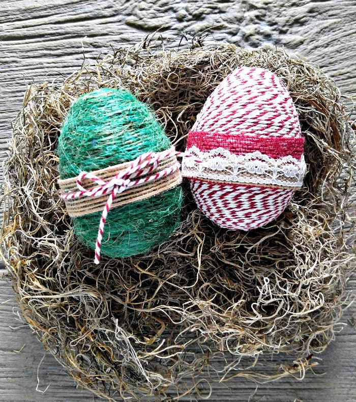 Green and striped rope wrapped eggs with burlap ribbon