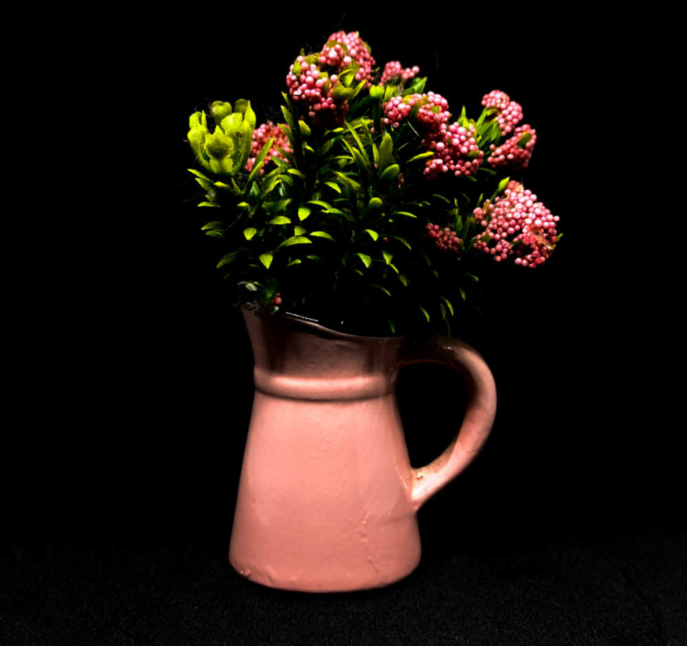 Kalanchoe blossfeldiana in pink pot.