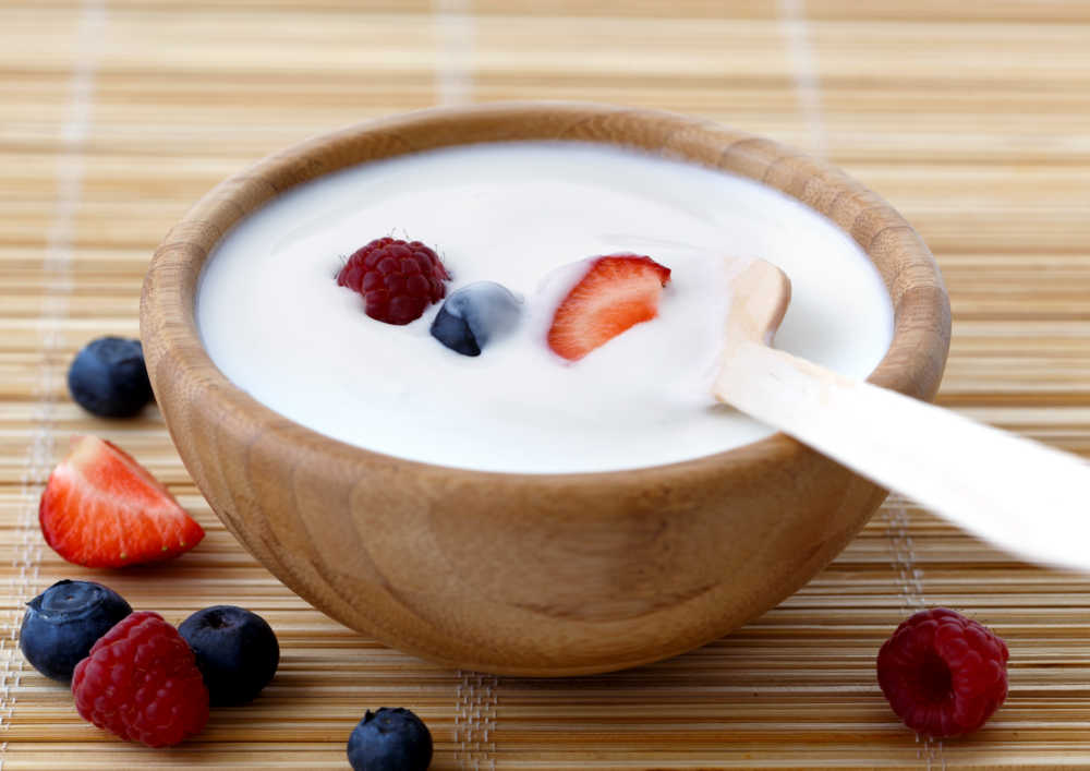 Bowl of Greek yogurt with fresh fruit.