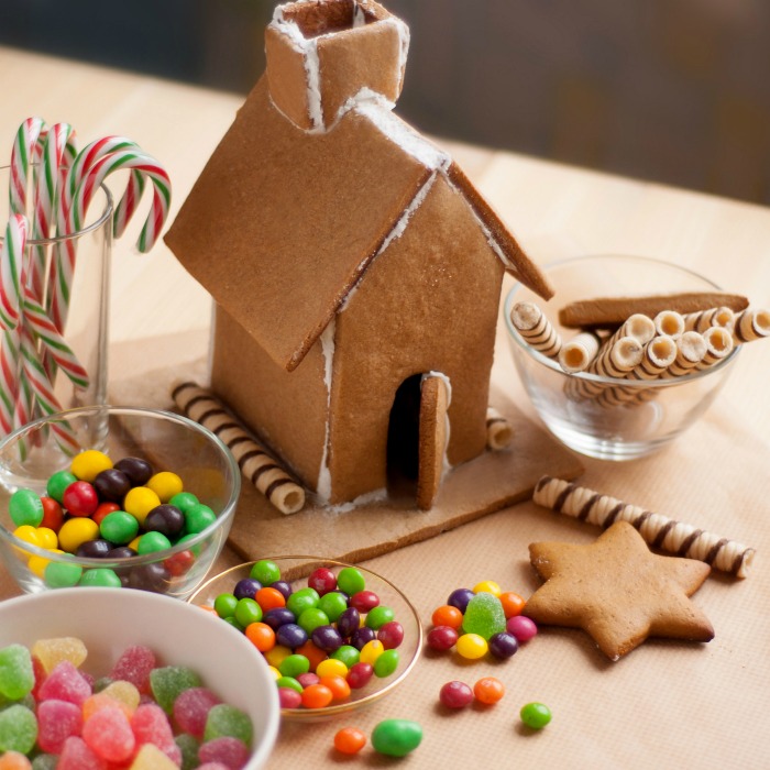 Candy and gingerbread house on a counter