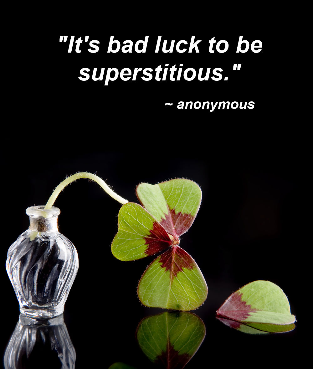 Bad luck quote. Broken oxalis shamrock plant with text reading "it's bad luck to be superstitious."
