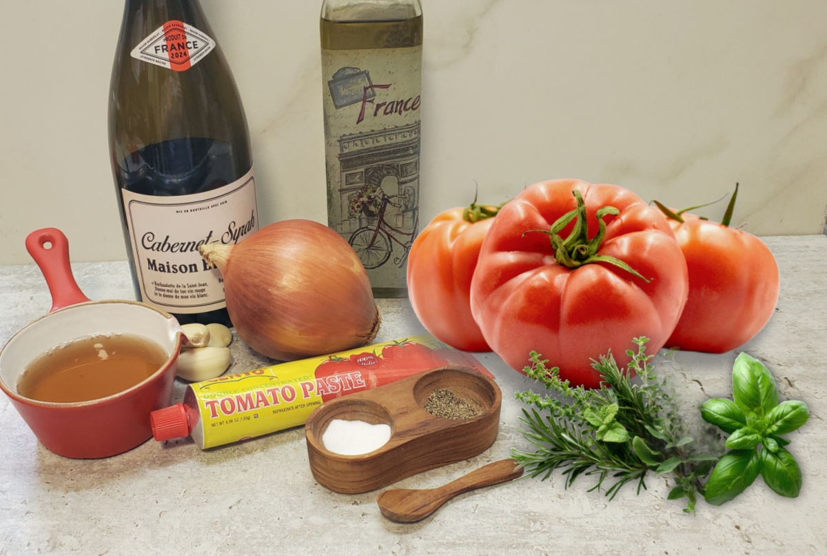 Ingredients for beefsteak pasta sauce: wine, olive oil, onion, garlic, salt, pepper, tomato pasta, fresh herbs, and beefsteak tomatoes.