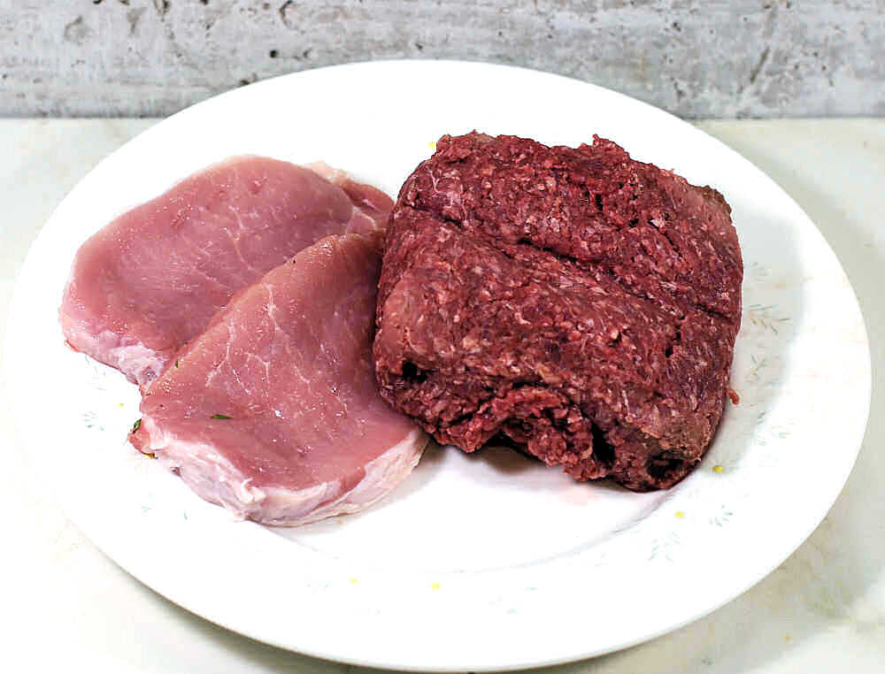 Lean pork and ground beef on a plate.