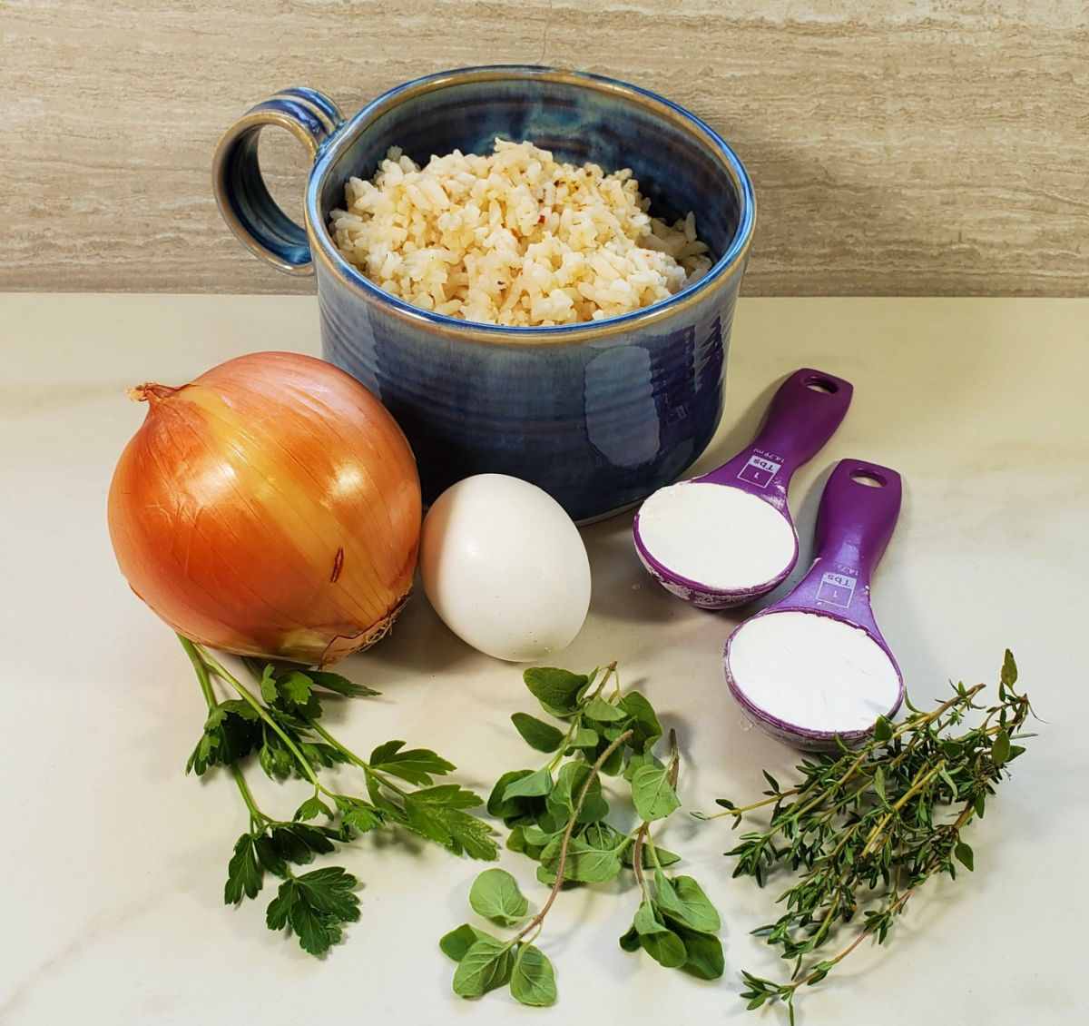 Ingredients for leftover rice patties, - onion, herbs and egg with cornstarch and rice.