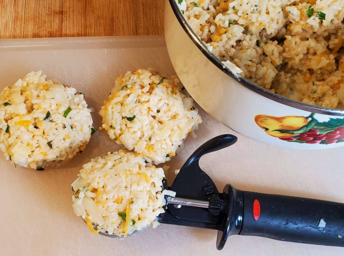 Making rice patties with a muffin scoop.