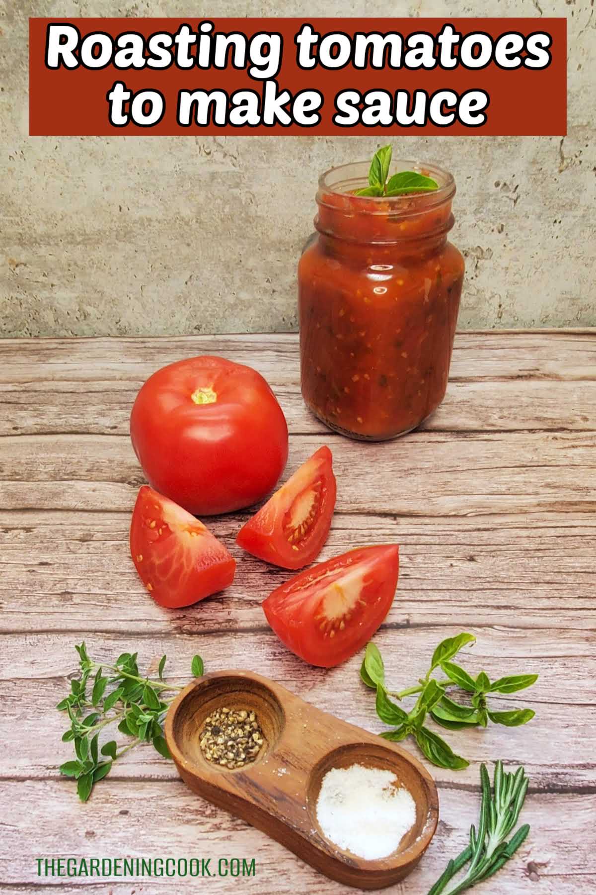Tomato sauce in a jar next to whole and sliced tomatoes, fresh herbs and salt and pepper. Red text box reads Roasting tomatoes for sauce.
