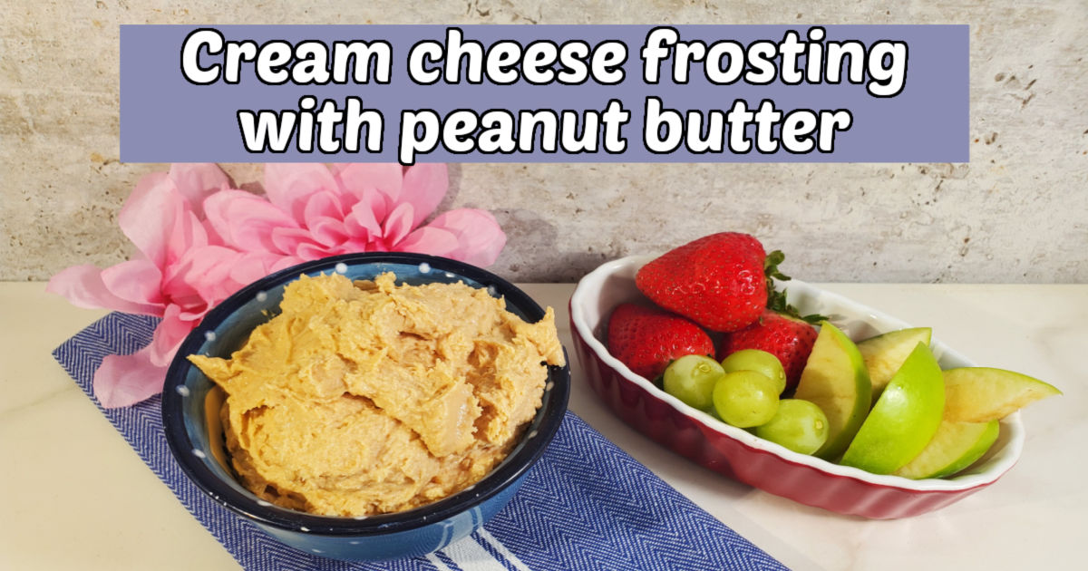 Frosting in a blue bowl next to bowl of fruit. Blue text box reads cream cheese frosting with peanut butter.