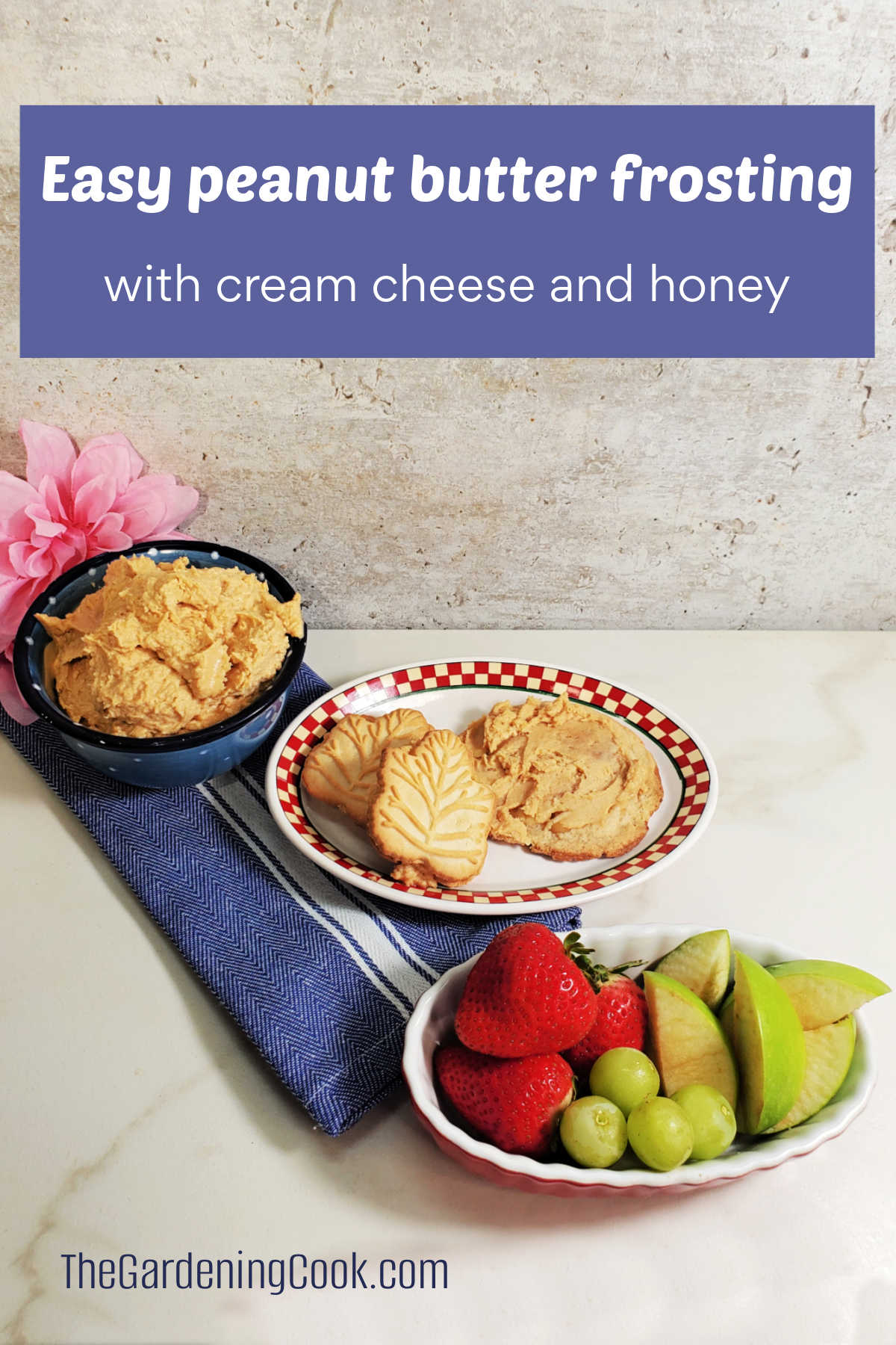 Frosting in a blue blow next to plates of fruit and frosted cookies. Blue text box reads Easy peanut butter frosting with cream cheese and honey.