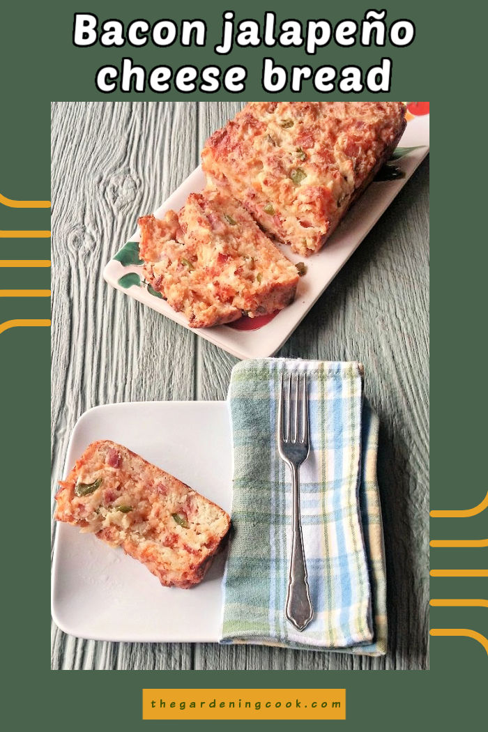 A loaf of no knead jalape&ntilde;o cheddar bread on a plate with a fork an dblue napkin. Text reads Bacon jalape&ntilde;o cheese bread.