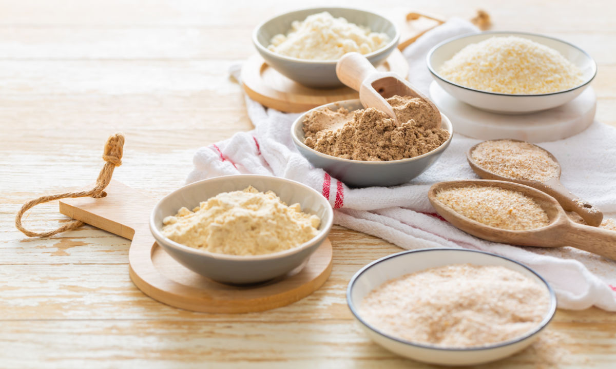 Bowls of gluten-free flour substitutes for baking.