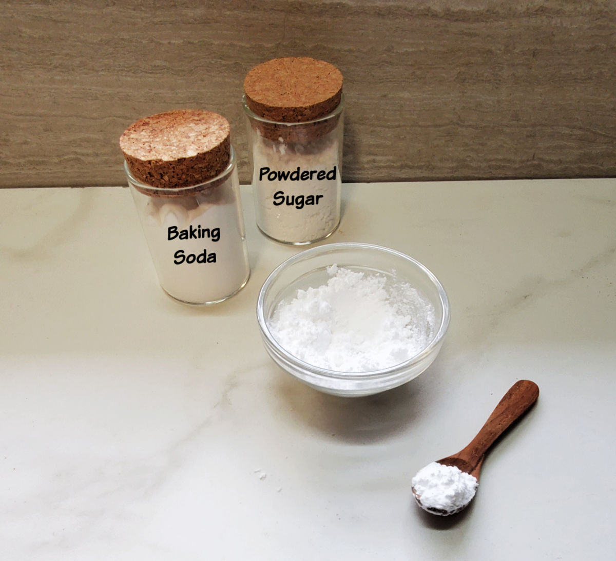 Small bottles with baking soda and powdered sugar to make an ant bait.